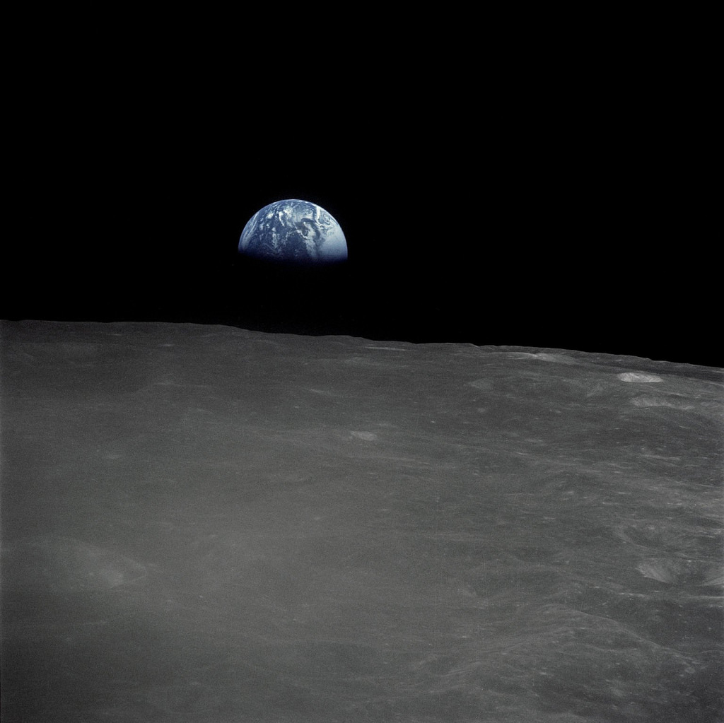 The Apollo 16 crew captured this Earthrise with a handheld Hasselblad camera during the second revolution of the moon. Identifiable craters seen on the moon include Saha, Wyld and Saenger. Much of the terrain seen here is never visible from the Earth, as the command module was passing over the far side of the moon. Apollo 16 launched on April 16, 1972 and landed on the moon on April 20. The mission was commanded by John Young; Thomas K. Mattingly II was the command module pilot and Charles M. Duke, Jr. served as the lunar module pilot. Image: NASA