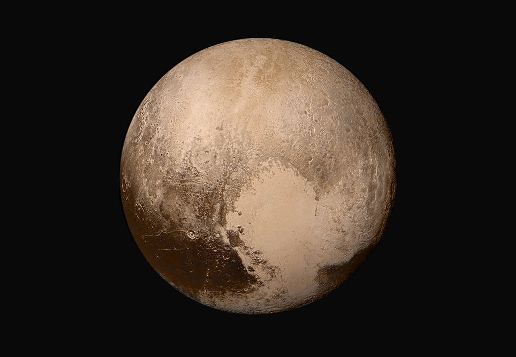 Four images from New Horizons’ Long Range Reconnaissance Imager (LORRI) were combined with color data from the Ralph instrument to create this sharper global view of Pluto. (The lower right edge of Pluto in this view currently lacks high-resolution color coverage.) The images, taken when the spacecraft was 280,000 miles (450,000 kilometers) away from Pluto, show features as small as 1.4 miles (2.2 kilometers). That’s twice the resolution of the single-image view captured on July 13 and revealed at the approximate time of New Horizons’ July 14 closest approach. Text: NASA, Image: NASA/JHUAPL/SwRI